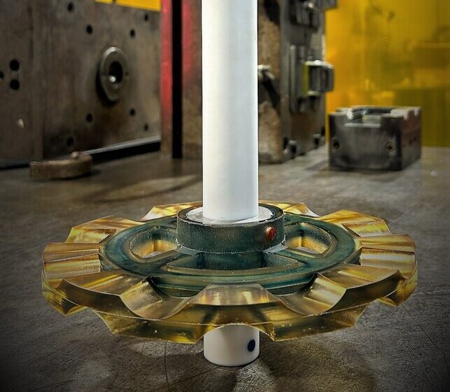 Mixing impeller with abrasion-resistant sheathed shaft